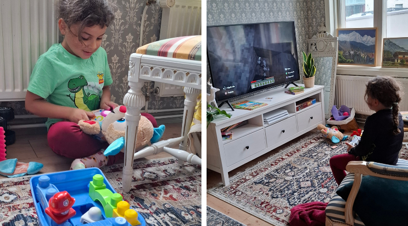 Poika leikkii hostellissa leluilla ja pelaa PlayStationia