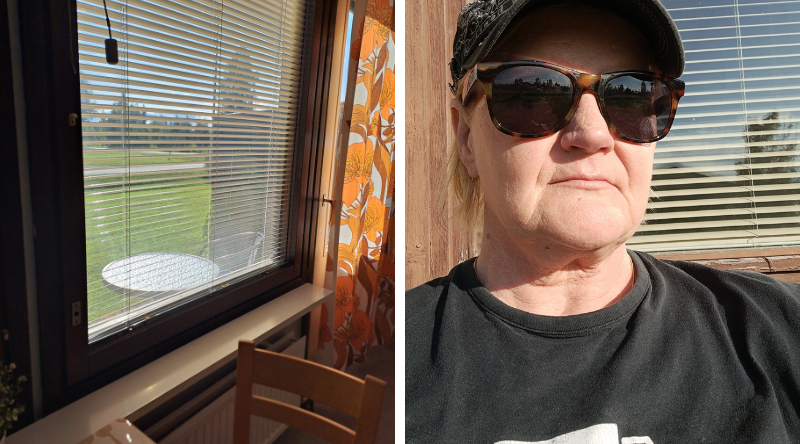 Ikkuna ja reissaaja takapihan auringossa